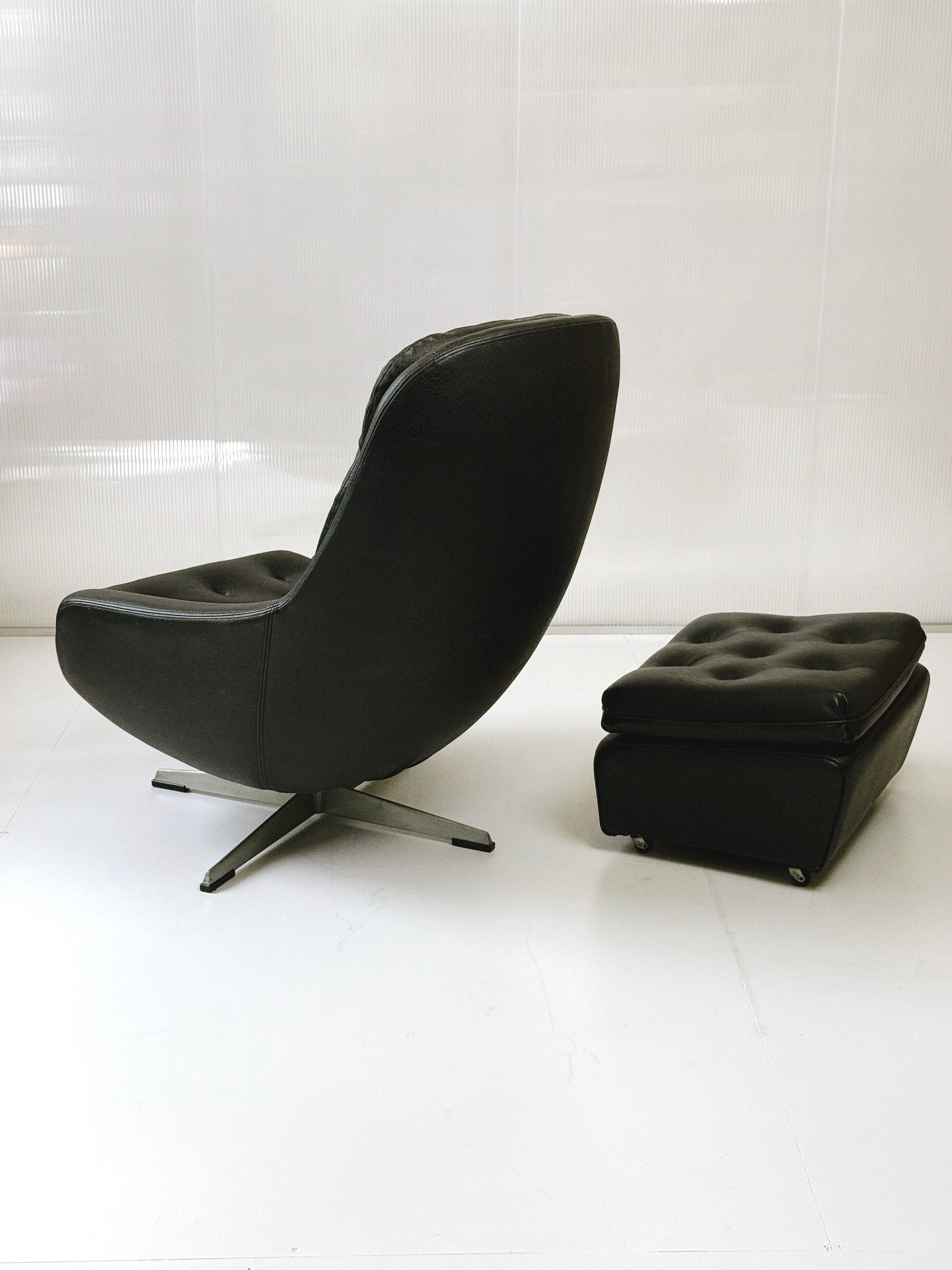 Danish swivel leather armchair & footstool